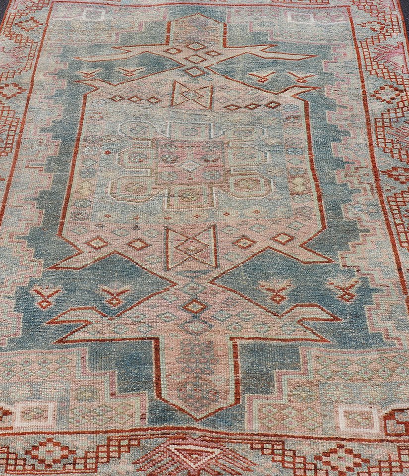 Persian Kurdish Antique Rug with Tribal Design in Light Blue, Teal, Taupe & Red Antique Kurdish rug with tribal geometric medallions in soft blue, pink, light blue, medium blue with hint of teal, brown, tape, salmon and red in the border. rug EM... - Keivan Woven ArtsEMB - 9509 - P13085 - 14620Rug