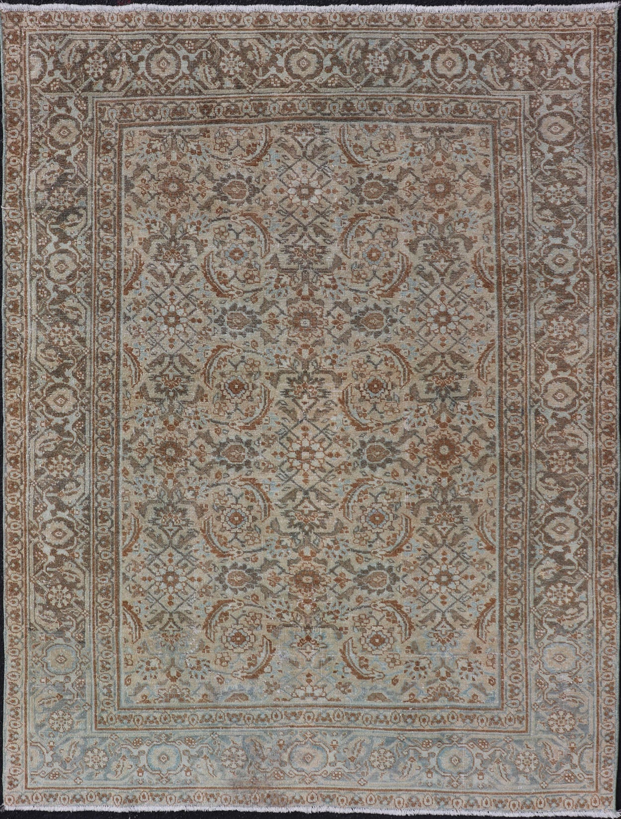 Antique Persian Tabriz Rug in Wool with All - Over Floral Design in Earth Colors This Tabriz rug features a relatively intricate and detailed border area and an entirely sparse and small repeating tribal motif in the center field. The tones of th... - Keivan Woven ArtsEMB - 9516 - P13065 - 14644Rug