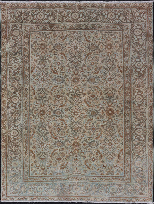 Antique Persian Tabriz Rug in Wool with All - Over Floral Design in Earth Colors This Tabriz rug features a relatively intricate and detailed border area and an entirely sparse and small repeating tribal motif in the center field. The tones of th... - Keivan Woven ArtsEMB - 9516 - P13065 - 14644Rug