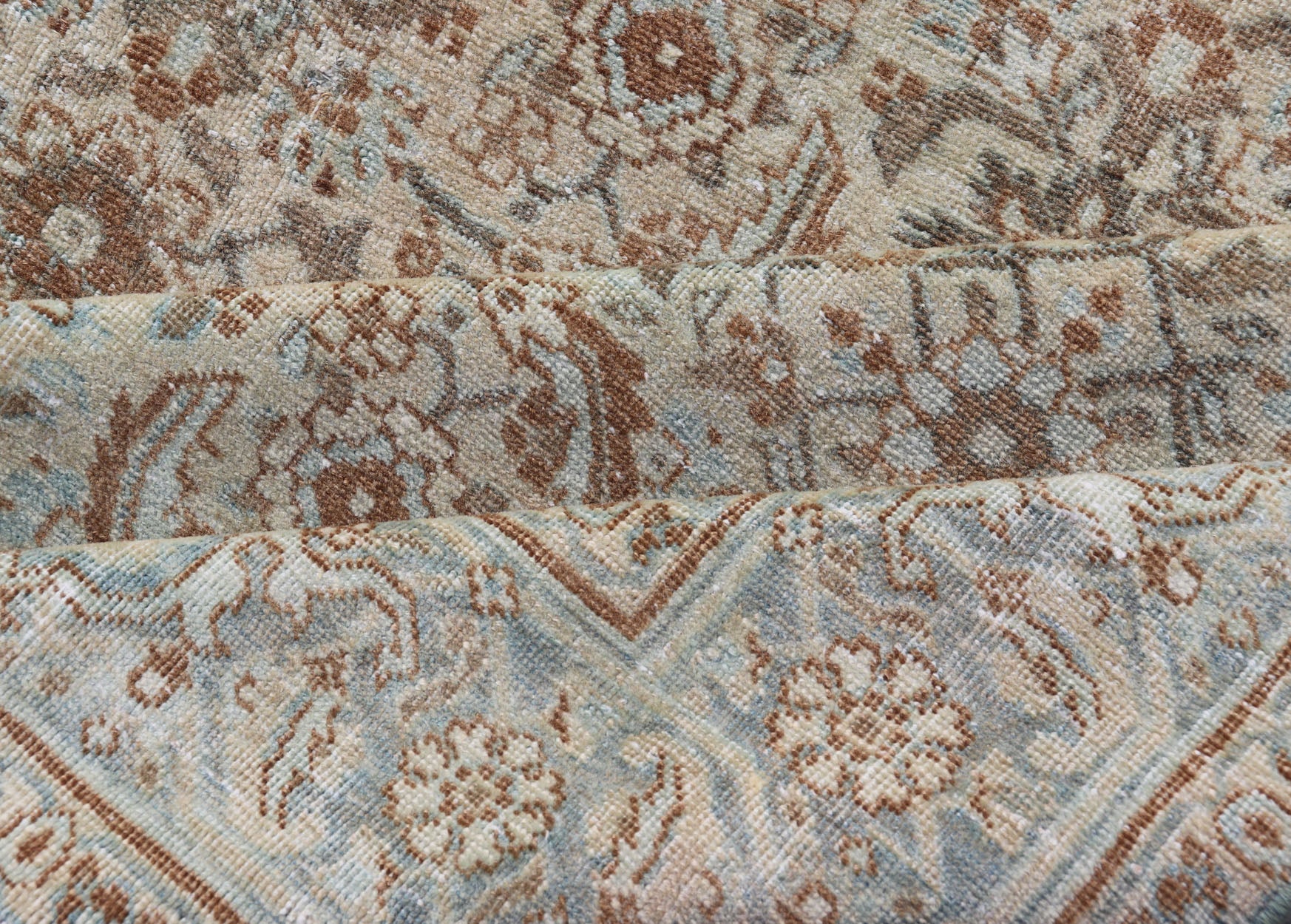 Antique Persian Tabriz Rug in Wool with All - Over Floral Design in Earth Colors This Tabriz rug features a relatively intricate and detailed border area and an entirely sparse and small repeating tribal motif in the center field. The tones of th... - Keivan Woven ArtsEMB - 9516 - P13065 - 14644Rug