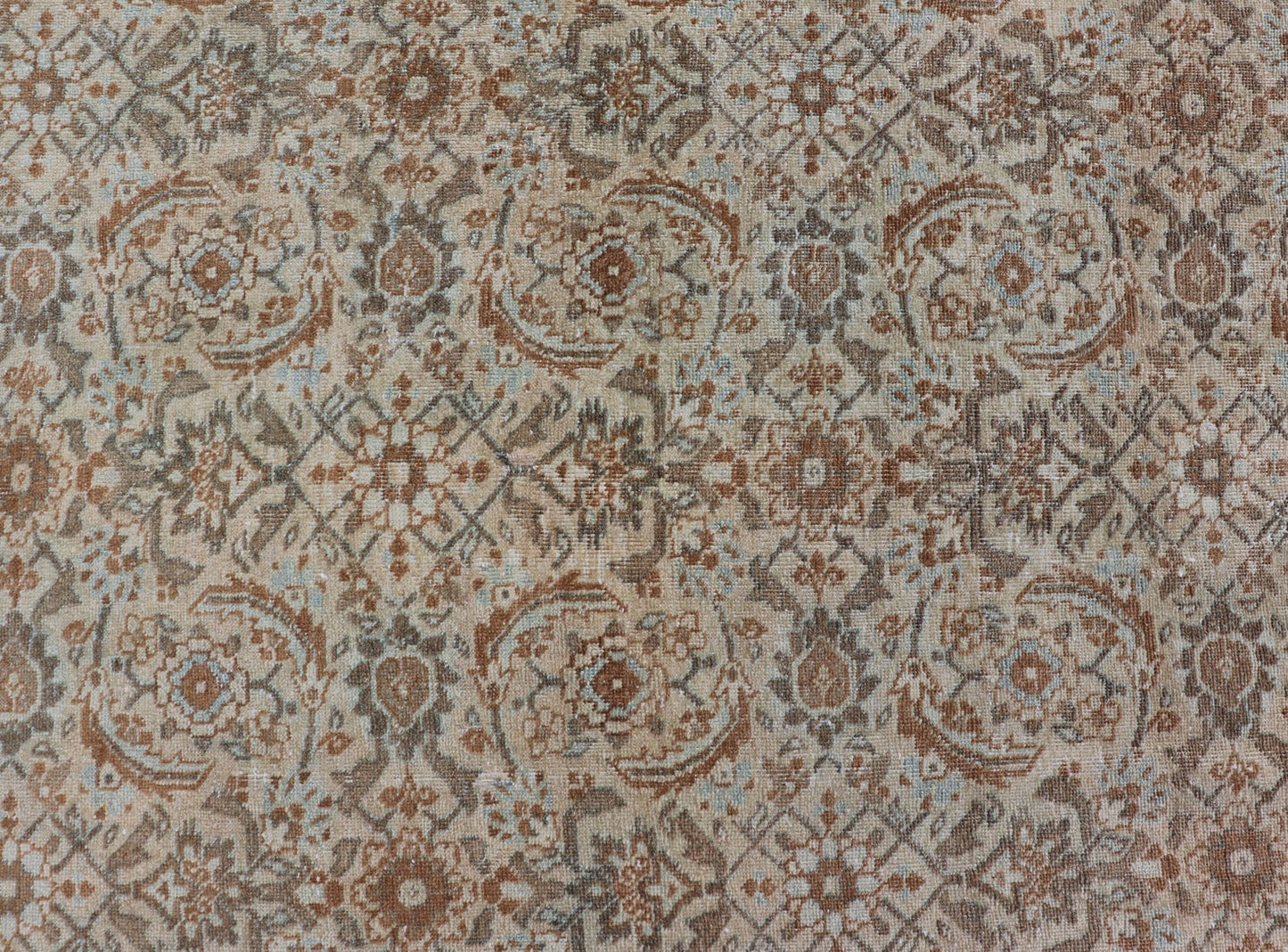 Antique Persian Tabriz Rug in Wool with All - Over Floral Design in Earth Colors This Tabriz rug features a relatively intricate and detailed border area and an entirely sparse and small repeating tribal motif in the center field. The tones of th... - Keivan Woven ArtsEMB - 9516 - P13065 - 14644Rug