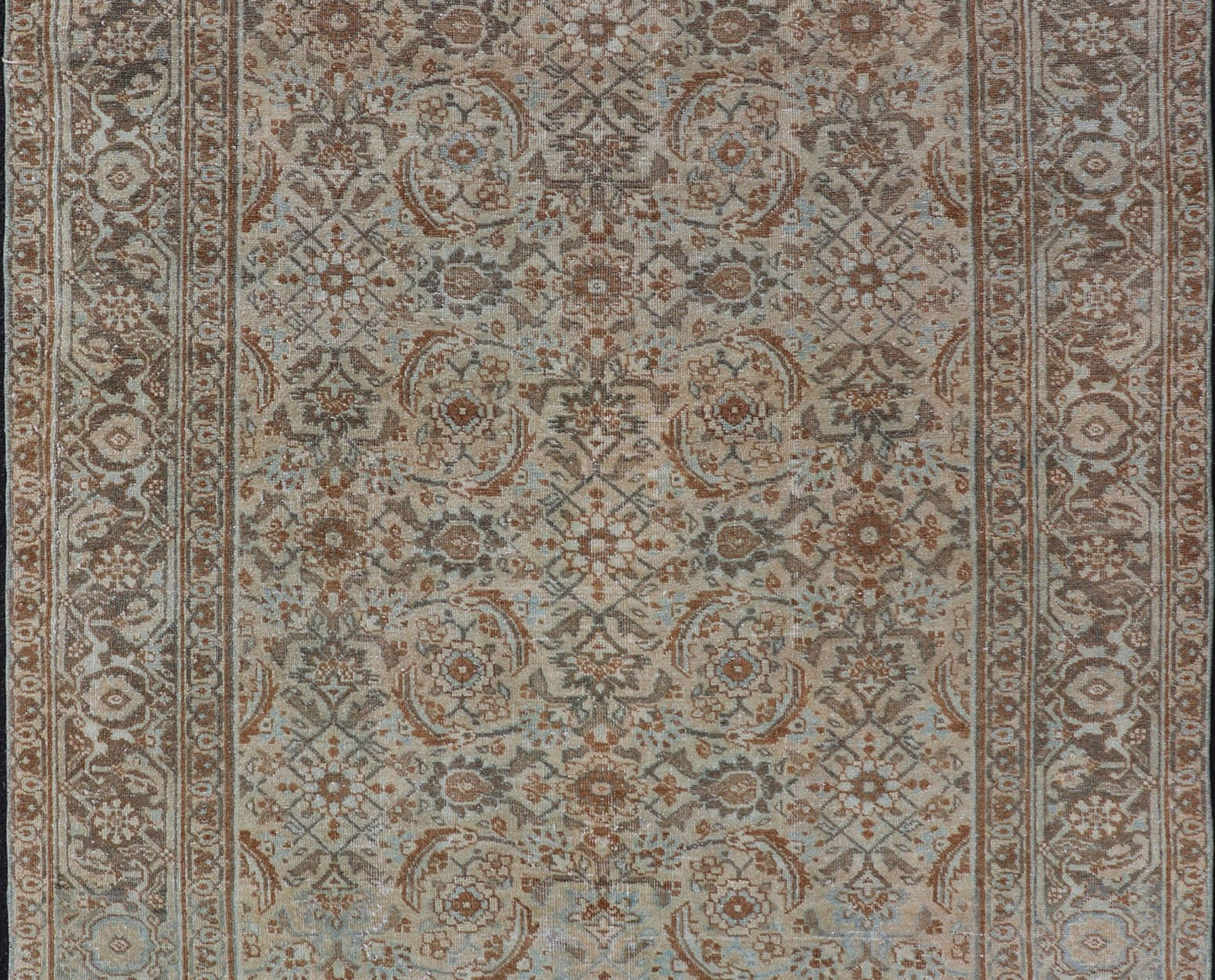 Antique Persian Tabriz Rug in Wool with All - Over Floral Design in Earth Colors This Tabriz rug features a relatively intricate and detailed border area and an entirely sparse and small repeating tribal motif in the center field. The tones of th... - Keivan Woven ArtsEMB - 9516 - P13065 - 14644Rug