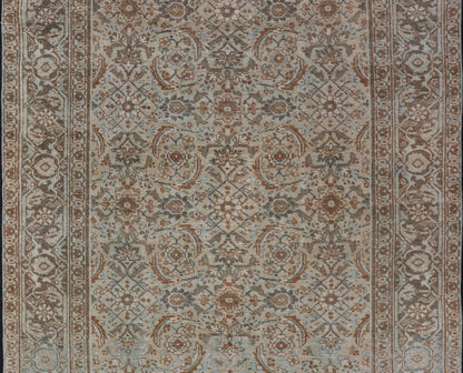 Antique Persian Tabriz Rug in Wool with All - Over Floral Design in Earth Colors This Tabriz rug features a relatively intricate and detailed border area and an entirely sparse and small repeating tribal motif in the center field. The tones of th... - Keivan Woven ArtsEMB - 9516 - P13065 - 14644Rug