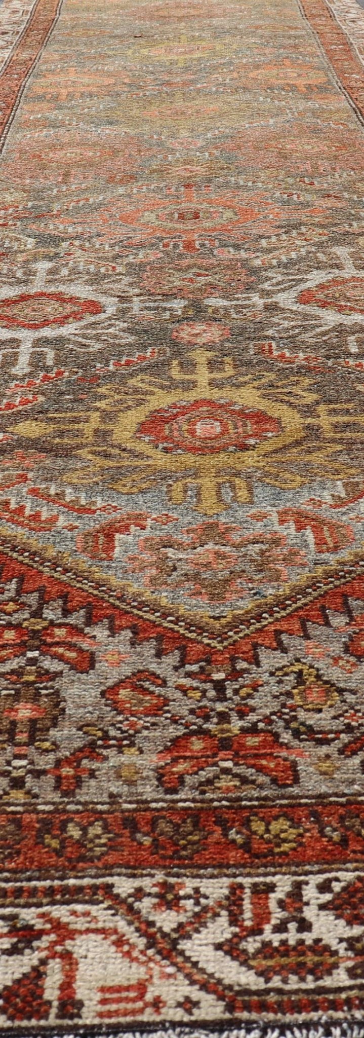 Antique Persian Hamadan Long Runner in Brown, Gray and Earth Tones Measures 2'6 x 16'3 This grand runner features a beautiful desert palette of orange, rustic gold, taupe, dulled cream, red, and camel, with a bright white border filled w... - Keivan Woven ArtsEMB - 9524 - P13062 - 14674Rug