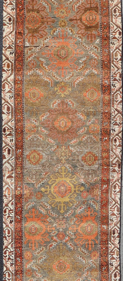 Antique Persian Hamadan Long Runner in Brown, Gray and Earth Tones Measures 2'6 x 16'3 This grand runner features a beautiful desert palette of orange, rustic gold, taupe, dulled cream, red, and camel, with a bright white border filled w... - Keivan Woven ArtsEMB - 9524 - P13062 - 14674Rug