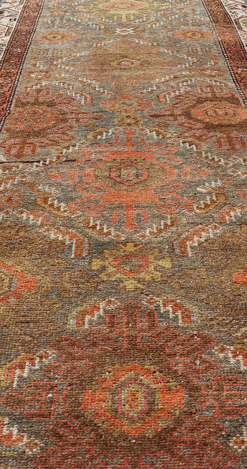 Antique Persian Hamadan Long Runner in Brown, Gray and Earth Tones Measures 2'6 x 16'3 This grand runner features a beautiful desert palette of orange, rustic gold, taupe, dulled cream, red, and camel, with a bright white border filled w... - Keivan Woven ArtsEMB - 9524 - P13062 - 14674Rug