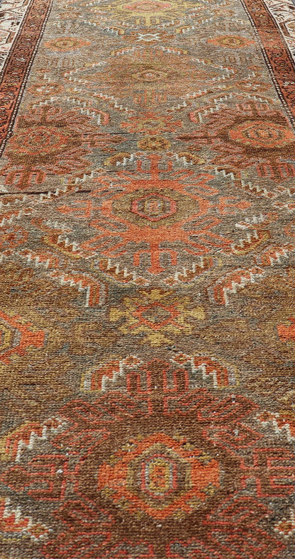 Antique Persian Hamadan Long Runner in Brown, Gray and Earth Tones Measures 2'6 x 16'3 This grand runner features a beautiful desert palette of orange, rustic gold, taupe, dulled cream, red, and camel, with a bright white border filled w... - Keivan Woven ArtsEMB - 9524 - P13062 - 14674Rug