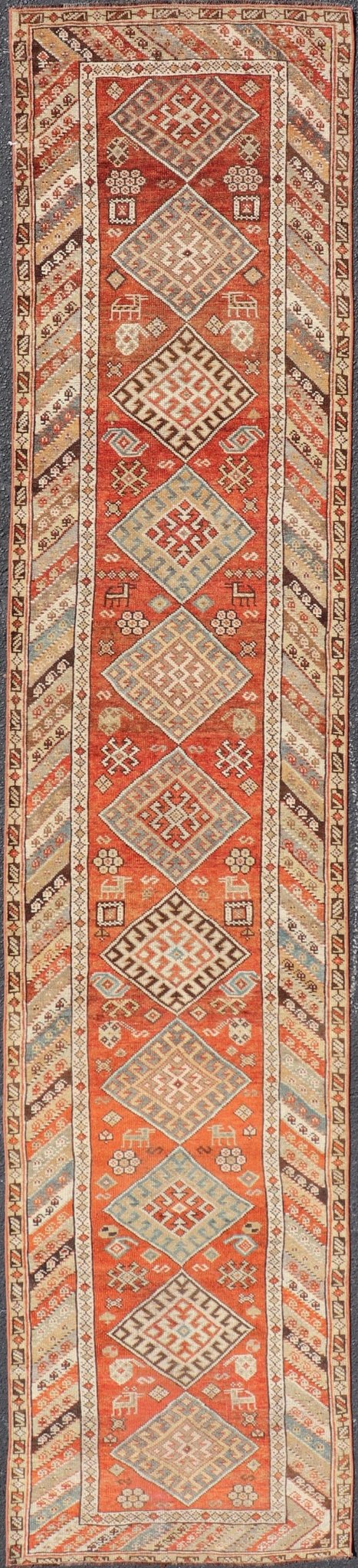 Antique Narrow And Long Kurdish Runner in Wool with Medallion Tribal Design This antique Persian Kurdish runner has been hand - knotted in wool and features a sub - geometric medallion design rendered in multicolor. A complementary, multi - tiered bor... - Keivan Woven ArtsEMB - 9525 - P13056 - 14680Rug