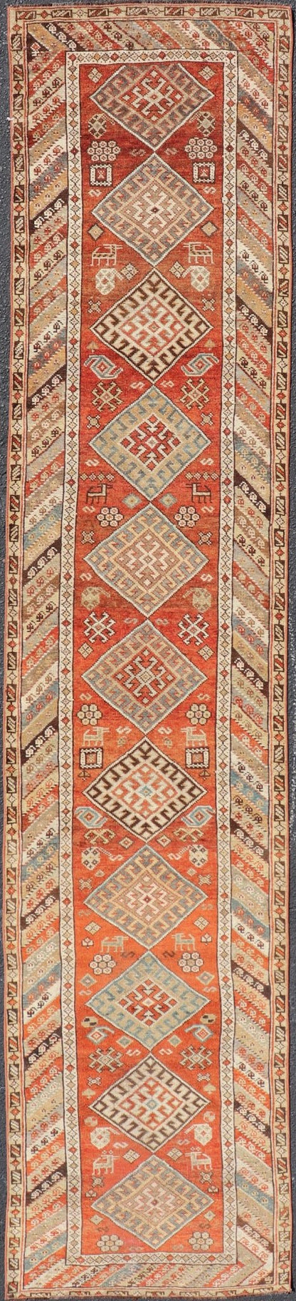Antique Narrow And Long Kurdish Runner in Wool with Medallion Tribal Design This antique Persian Kurdish runner has been hand - knotted in wool and features a sub - geometric medallion design rendered in multicolor. A complementary, multi - tiered bor... - Keivan Woven ArtsEMB - 9525 - P13056 - 14680Rug