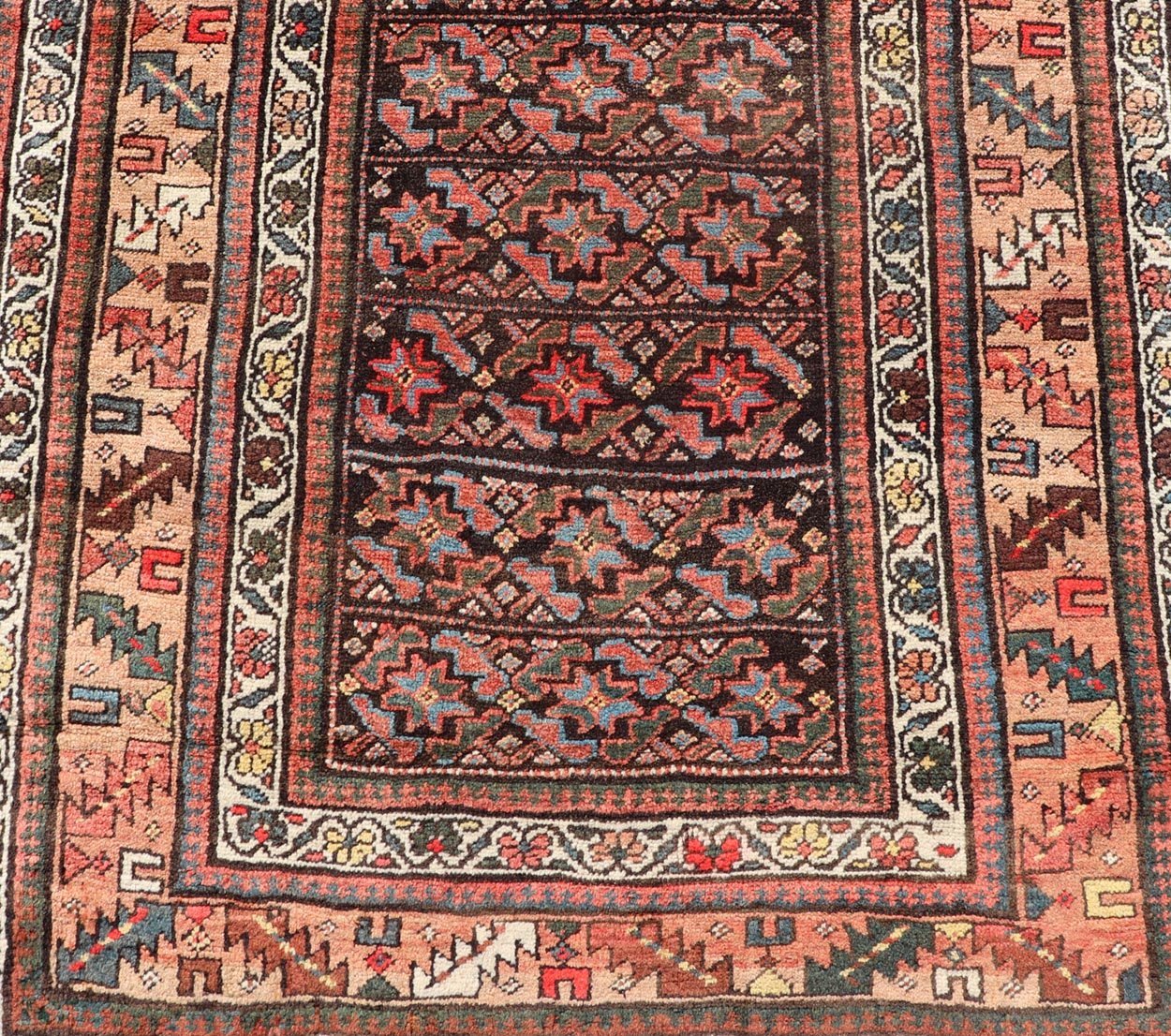 Antique Kurdish Runner with All - Over Geometric Design on A Blue Background Measures: 3'9 x 13'7 This antique runner from Persia features geometric tribal star motifs in a blue background, with accent colors of red, blue, green, and ... - Keivan Woven ArtsEMB - 9526 - P13054 - 14686Rug