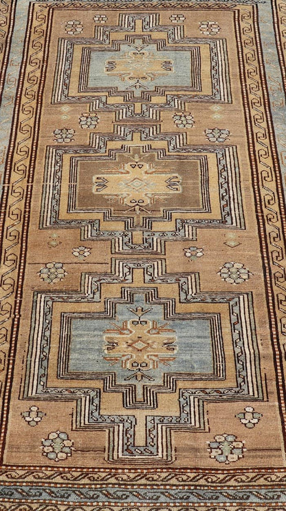Antique Persian Kurdish Rug in Wool with Tri - Medallion Design in Brown and Blue This antique Persian Tabriz rug has been hand - knotted in wool and features a large tri - medallion design rendered in blue - gray and earthy tones. A complementary, mul... - Keivan Woven ArtsEMB - 9529 - P13069 - 14692Rug