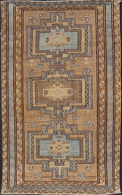 Antique Persian Kurdish Rug in Wool with Tri - Medallion Design in Brown and Blue This antique Persian Tabriz rug has been hand - knotted in wool and features a large tri - medallion design rendered in blue - gray and earthy tones. A complementary, mul... - Keivan Woven ArtsEMB - 9529 - P13069 - 14692Rug