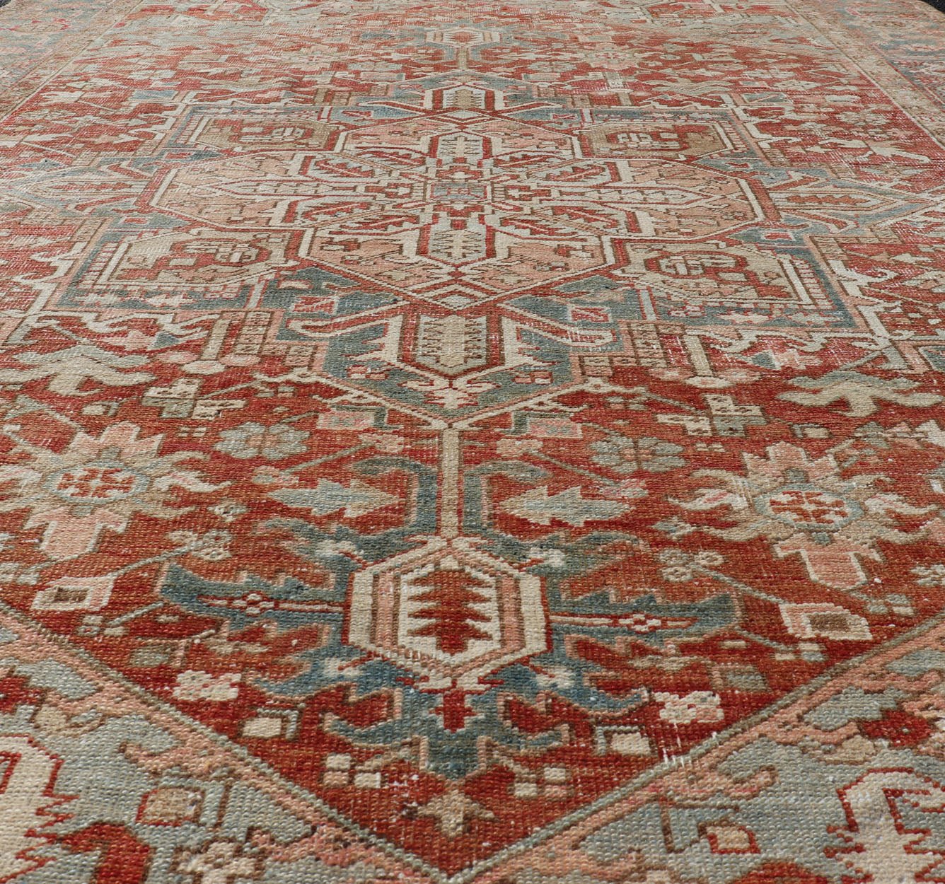 Antique Heriz Rug with All - Over Medallion Design in Red, Blue, Pink, Tan & Brown Antique Heriz Rug, rug EMB - 9533 - P13059, country of origin / type: Persian / Heriz, circa Early - 20th Century. Measures: 6'11 x 9'7. - Keivan Woven ArtsEMB - 9533 - P13059 - 14716Rug