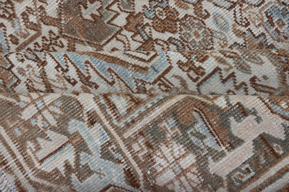 Vintage Hand - Knotted Heriz Rug with Sub - Geometric Design in Natural Tones This vintage hand - knotted Persian Heriz rug features an all - over sub - geometric design, enclosed within a complementary, multi - tiered border. The rug is rendered in blues... - Keivan Woven ArtsEMB - 9540 - P13089 - 14758Rug