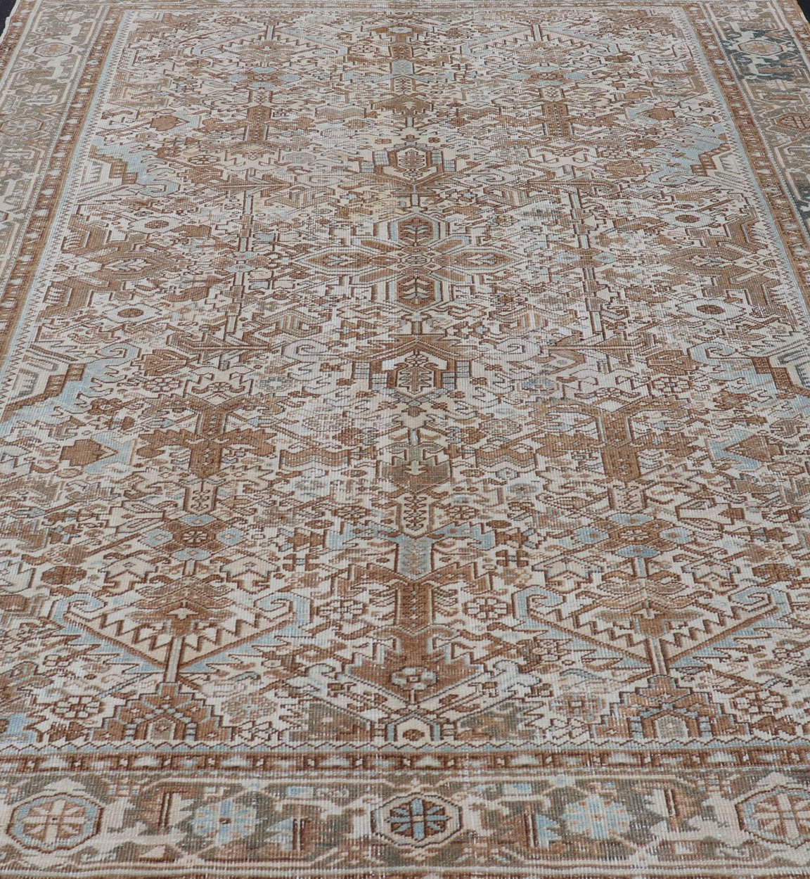 Vintage Hand - Knotted Heriz Rug with Sub - Geometric Design in Natural Tones This vintage hand - knotted Persian Heriz rug features an all - over sub - geometric design, enclosed within a complementary, multi - tiered border. The rug is rendered in blues... - Keivan Woven ArtsEMB - 9540 - P13089 - 14758Rug