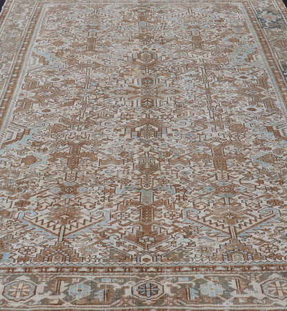 Vintage Hand - Knotted Heriz Rug with Sub - Geometric Design in Natural Tones This vintage hand - knotted Persian Heriz rug features an all - over sub - geometric design, enclosed within a complementary, multi - tiered border. The rug is rendered in blues... - Keivan Woven ArtsEMB - 9540 - P13089 - 14758Rug
