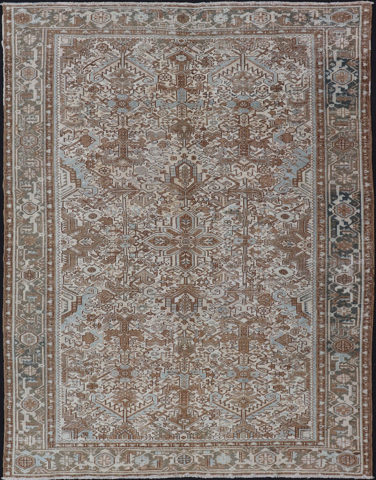 Vintage Hand - Knotted Heriz Rug with Sub - Geometric Design in Natural Tones This vintage hand - knotted Persian Heriz rug features an all - over sub - geometric design, enclosed within a complementary, multi - tiered border. The rug is rendered in blues... - Keivan Woven ArtsEMB - 9540 - P13089 - 14758Rug