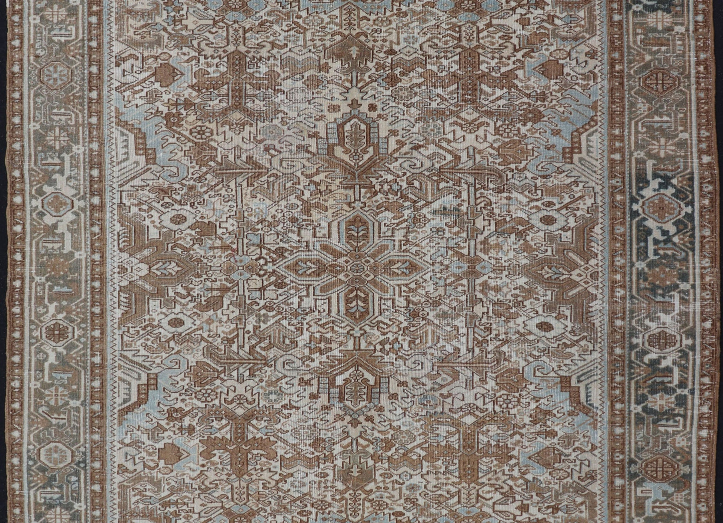 Vintage Hand - Knotted Heriz Rug with Sub - Geometric Design in Natural Tones This vintage hand - knotted Persian Heriz rug features an all - over sub - geometric design, enclosed within a complementary, multi - tiered border. The rug is rendered in blues... - Keivan Woven ArtsEMB - 9540 - P13089 - 14758Rug
