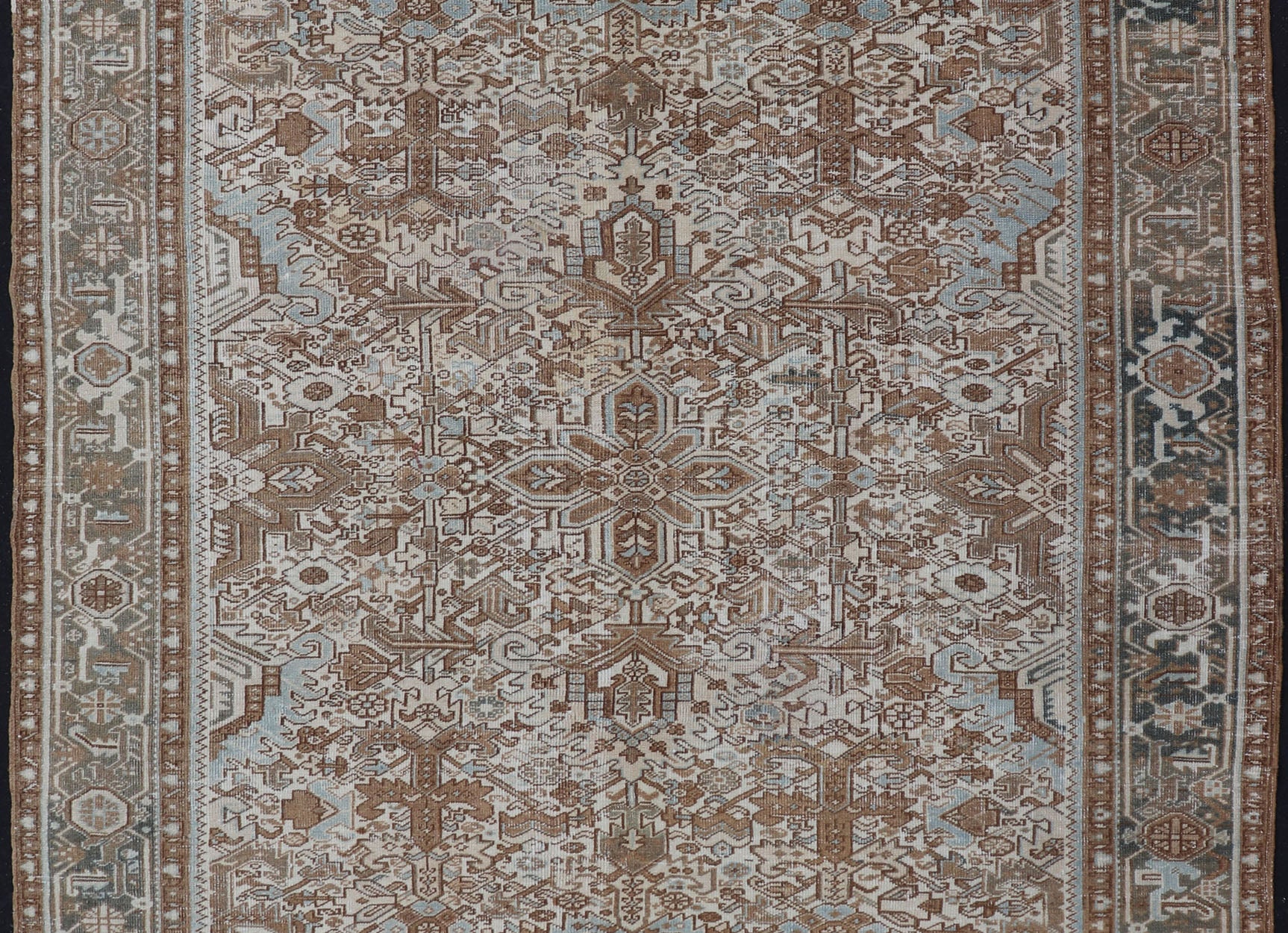 Vintage Hand - Knotted Heriz Rug with Sub - Geometric Design in Natural Tones This vintage hand - knotted Persian Heriz rug features an all - over sub - geometric design, enclosed within a complementary, multi - tiered border. The rug is rendered in blues... - Keivan Woven ArtsEMB - 9540 - P13089 - 14758Rug