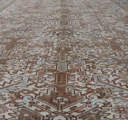 Vintage Hand - Knotted Heriz Rug with Sub - Geometric Design in Natural Tones This vintage hand - knotted Persian Heriz rug features an all - over sub - geometric design, enclosed within a complementary, multi - tiered border. The rug is rendered in blues... - Keivan Woven ArtsEMB - 9540 - P13089 - 14758Rug