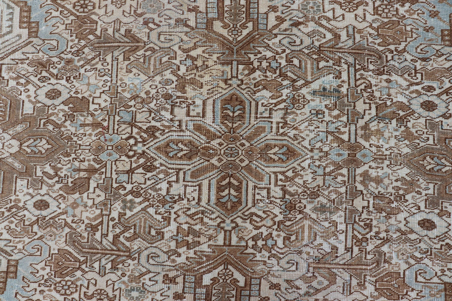 Vintage Hand - Knotted Heriz Rug with Sub - Geometric Design in Natural Tones This vintage hand - knotted Persian Heriz rug features an all - over sub - geometric design, enclosed within a complementary, multi - tiered border. The rug is rendered in blues... - Keivan Woven ArtsEMB - 9540 - P13089 - 14758Rug