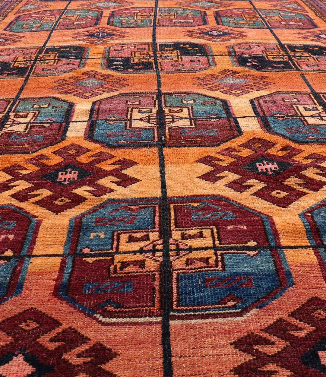 Measures: 5'0 x 8'10 Vintage Wool Ersari Rug in Wool with Gul Design in Orange, Blue, and Brown. Keivan Woven Arts; rug EMB - 9543 - 13058, country of origin / type: Turkestan / Ersari, circa 1930s. This Turkomen Ersari rug has been hand - knotted... - Keivan Woven ArtsEMB - 9543 - 13058 - 14782Rug
