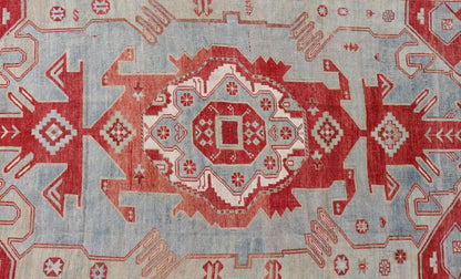 Antique Caucasian Kazak Rug with Tribal Geometric Medallion In Red. light green, ivory & Lt. Blue. Tribal geometric with stretched medallion design antique Kazak rug, antique rug from Caucasus Region in multi - colors. Keivan Woven Arts / rug EMB - ... - Keivan Woven ArtsEMB - 9552 - P13035 - 14818Rug