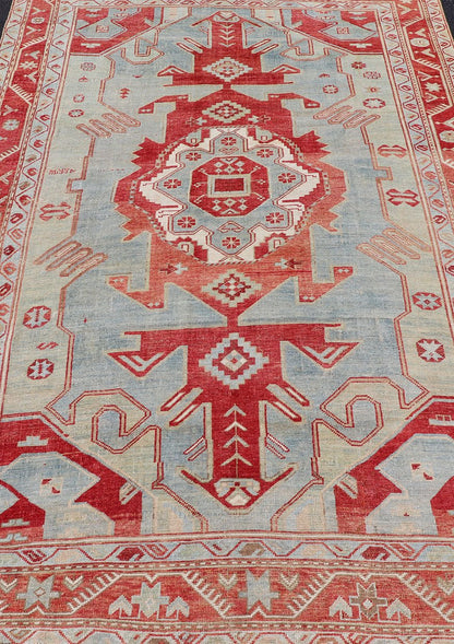Antique Caucasian Kazak Rug with Tribal Geometric Medallion In Red. light green, ivory & Lt. Blue. Tribal geometric with stretched medallion design antique Kazak rug, antique rug from Caucasus Region in multi - colors. Keivan Woven Arts / rug EMB - ... - Keivan Woven ArtsEMB - 9552 - P13035 - 14818Rug