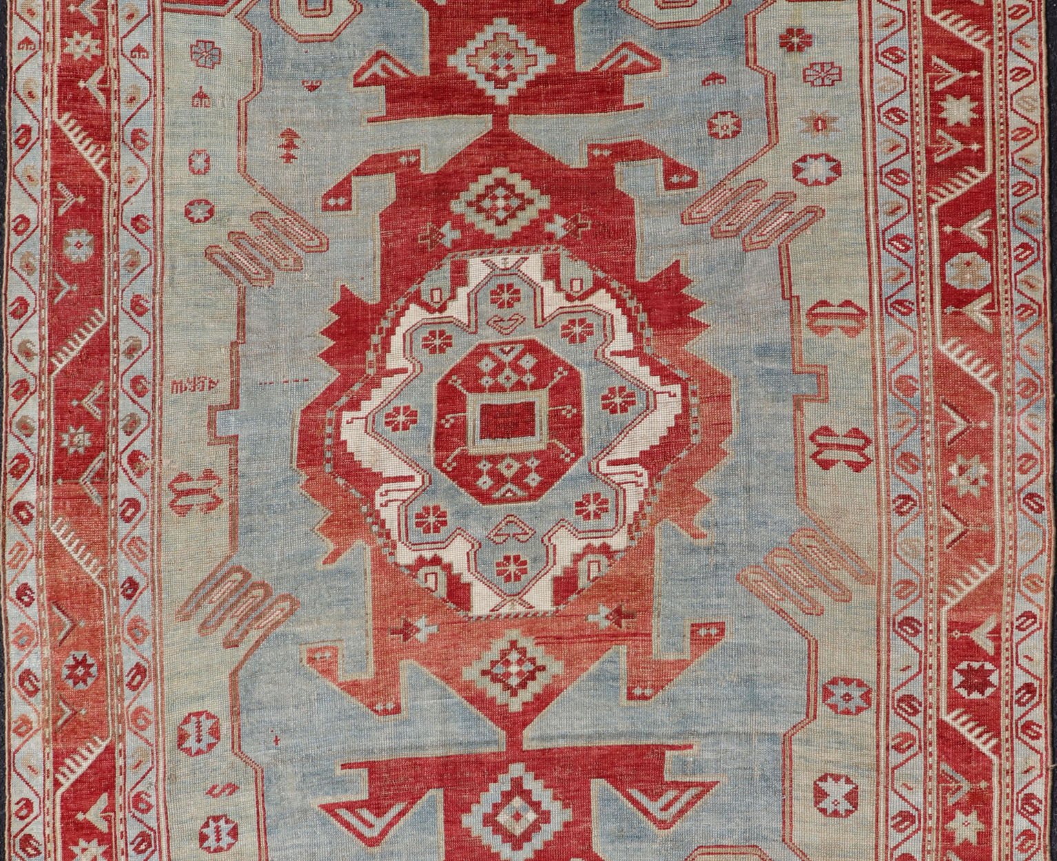 Antique Caucasian Kazak Rug with Tribal Geometric Medallion In Red. light green, ivory & Lt. Blue. Tribal geometric with stretched medallion design antique Kazak rug, antique rug from Caucasus Region in multi - colors. Keivan Woven Arts / rug EMB - ... - Keivan Woven ArtsEMB - 9552 - P13035 - 14818Rug