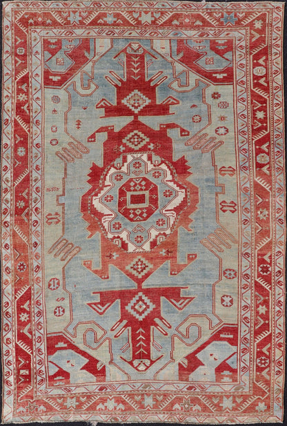Antique Caucasian Kazak Rug with Tribal Geometric Medallion In Red. light green, ivory & Lt. Blue. Tribal geometric with stretched medallion design antique Kazak rug, antique rug from Caucasus Region in multi - colors. Keivan Woven Arts / rug EMB - ... - Keivan Woven ArtsEMB - 9552 - P13035 - 14818Rug