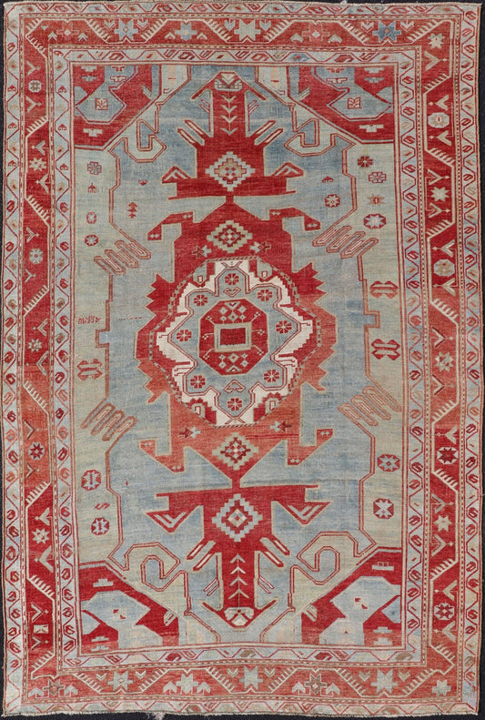Antique Caucasian Kazak Rug with Tribal Geometric Medallion In Red. light green, ivory & Lt. Blue. Tribal geometric with stretched medallion design antique Kazak rug, antique rug from Caucasus Region in multi - colors. Keivan Woven Arts / rug EMB - ... - Keivan Woven ArtsEMB - 9552 - P13035 - 14818Rug