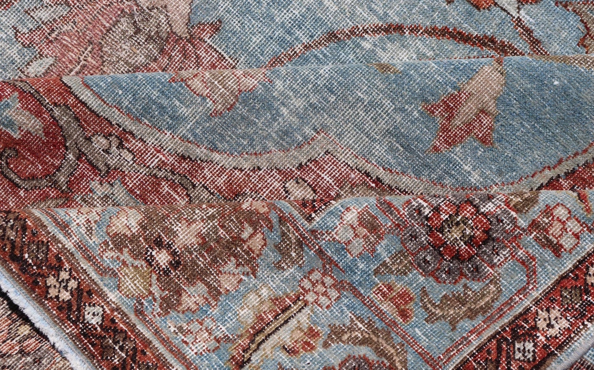 Hand - Knotted Antique Persian Tabriz Khoy Rug in Wool with Large Floral Design This antique Persian Tabriz Khoy rug features an all - over sub - geometric floral design rendered in multicolor, set upon a red background. A complementary, multi - tiered... - Keivan Woven ArtsEMB - 9556 - P13091 - 14868Rug