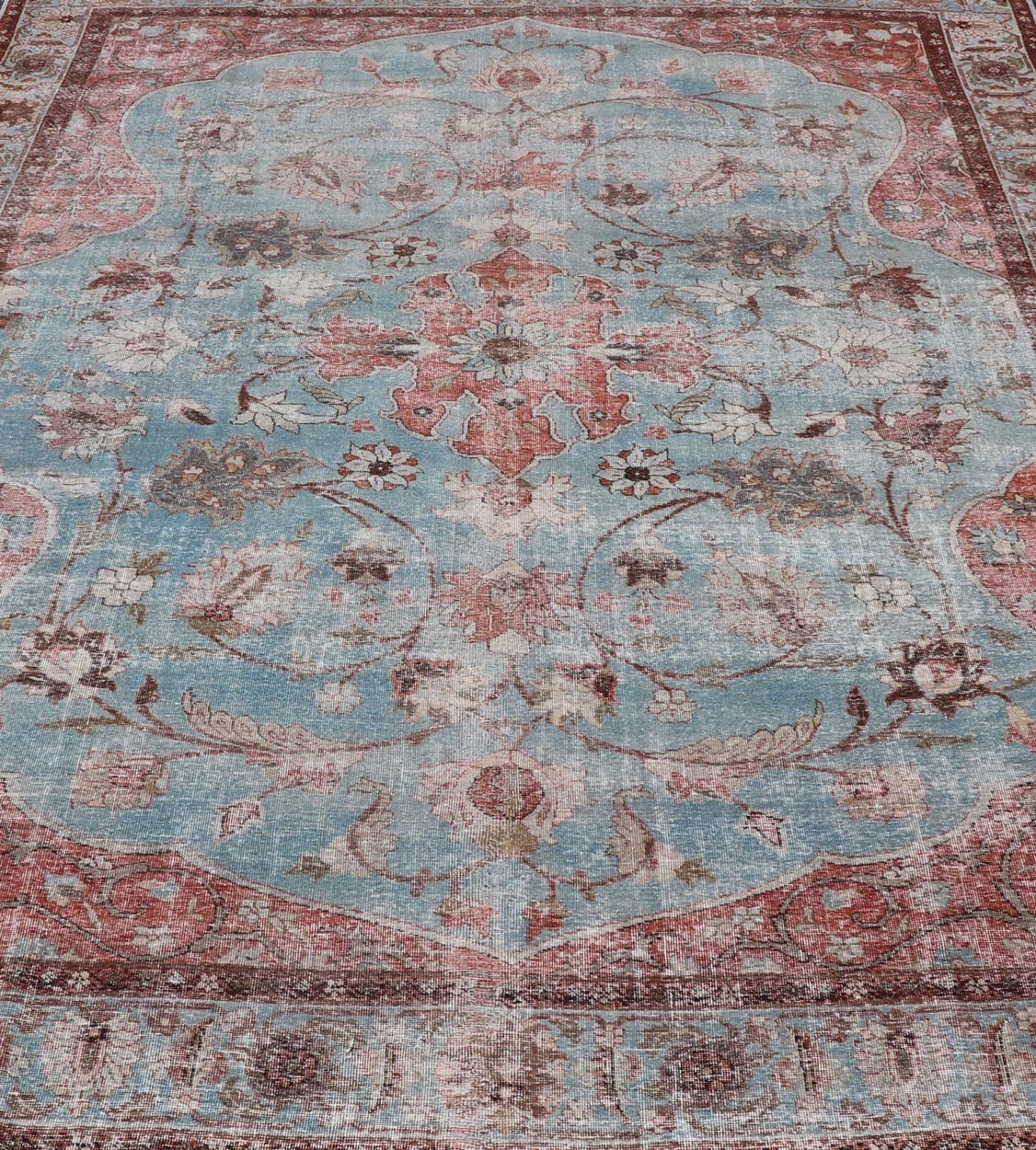 Hand - Knotted Antique Persian Tabriz Khoy Rug in Wool with Large Floral Design This antique Persian Tabriz Khoy rug features an all - over sub - geometric floral design rendered in multicolor, set upon a red background. A complementary, multi - tiered... - Keivan Woven ArtsEMB - 9556 - P13091 - 14868Rug