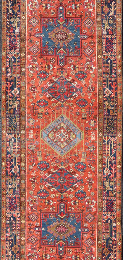 Very Long antique Persian Heriz runner with geometric medallion design in red, blue and colorful tones. Keivan Woven Arts / rug EMB - 9560 - P13076 , country of origin / type: Iran / Heriz, circa 1900 Measures:3'4 x 14'4 Antique Hand Knotted ... - Keivan Woven ArtsEMB - 9560 - P13076 - 14568Rug