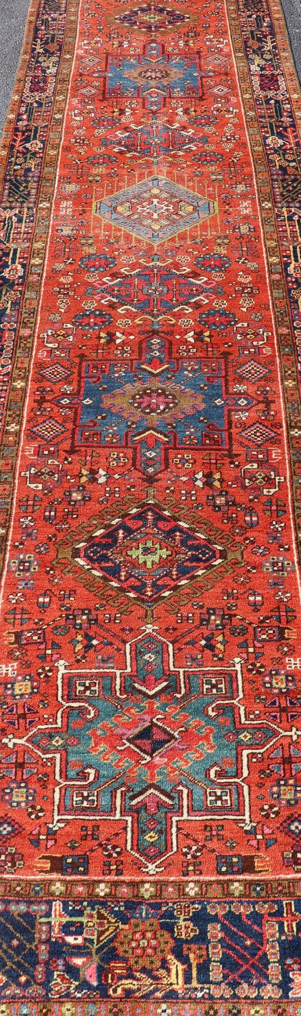Very Long antique Persian Heriz runner with geometric medallion design in red, blue and colorful tones. Keivan Woven Arts / rug EMB - 9560 - P13076 , country of origin / type: Iran / Heriz, circa 1900 Measures:3'4 x 14'4 Antique Hand Knotted ... - Keivan Woven ArtsEMB - 9560 - P13076 - 14568Rug