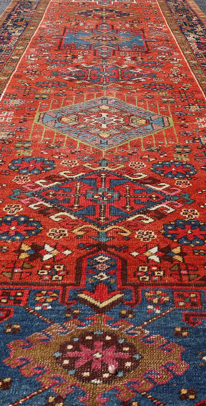 Very Long antique Persian Heriz runner with geometric medallion design in red, blue and colorful tones. Keivan Woven Arts / rug EMB - 9560 - P13076 , country of origin / type: Iran / Heriz, circa 1900 Measures:3'4 x 14'4 Antique Hand Knotted ... - Keivan Woven ArtsEMB - 9560 - P13076 - 14568Rug