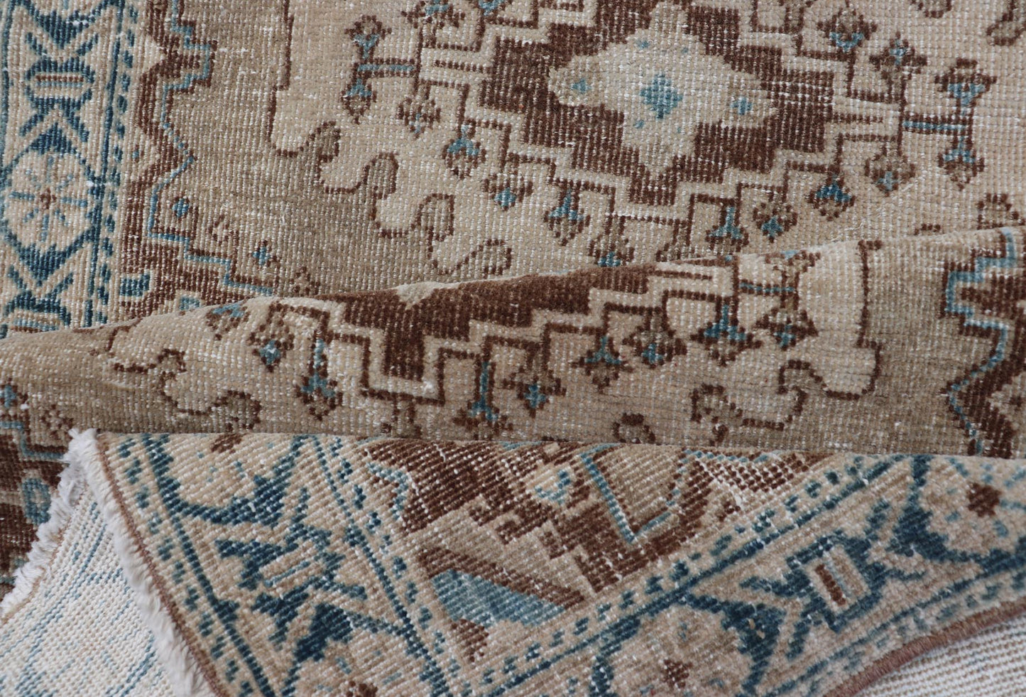 Long Hand - Knotted Antique Heriz Runner in Wool with Sub - Geometric Medallions This antique Persian Heriz runner features a sub - geometric medallion design rendered in blue, tan, brown and cream tones, set upon a tan background. A complementary, m... - Keivan Woven ArtsEMB - 9563 - P13884 - 14910Rug