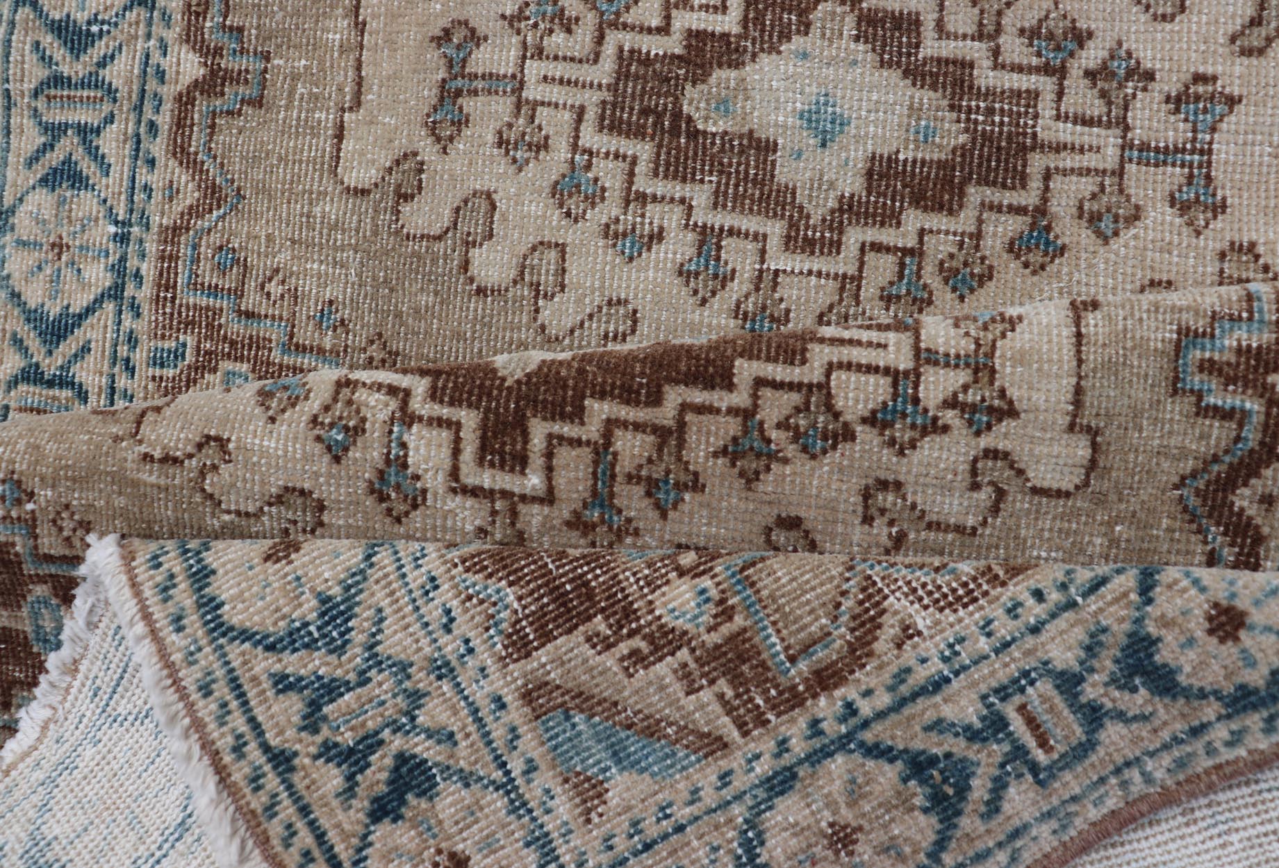 Long Hand - Knotted Antique Heriz Runner in Wool with Sub - Geometric Medallions This antique Persian Heriz runner features a sub - geometric medallion design rendered in blue, tan, brown and cream tones, set upon a tan background. A complementary, m... - Keivan Woven ArtsEMB - 9563 - P13884 - 14910Rug