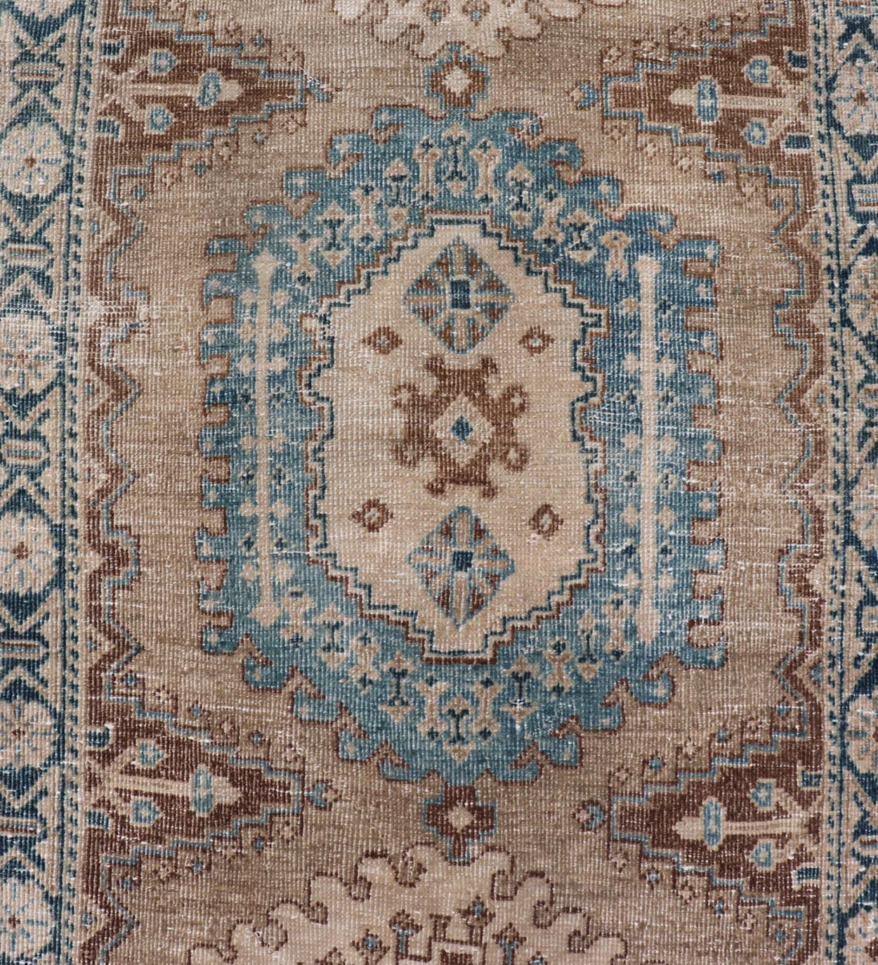 Long Hand - Knotted Antique Heriz Runner in Wool with Sub - Geometric Medallions This antique Persian Heriz runner features a sub - geometric medallion design rendered in blue, tan, brown and cream tones, set upon a tan background. A complementary, m... - Keivan Woven ArtsEMB - 9563 - P13884 - 14910Rug