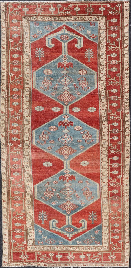 Antique Kurdish Medallion Gallery Runner in Red, Denim Blue, and Eggshell With brilliant design and vibrant colors, this Kurdish medallion - designed gallery runner features a bold burnt red, accompanied by a soft denim blue. Accent motifs of fawn... - Keivan Woven ArtsEMB - 9564 - P13082 - 14916Rug