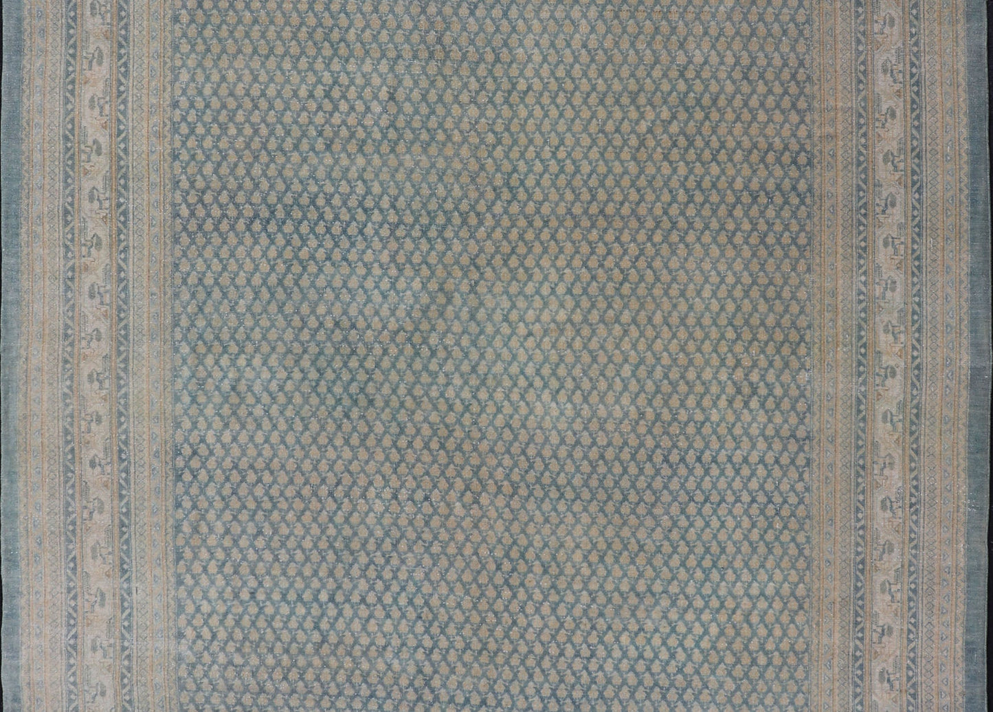 Hand - Knotted Antique Persian Tabriz Rug in Wool with Minimalist Design This Tabriz rug features a relatively intricate and detailed border area and an entirely sparse and small repeating tribal motif in the center field. The tones of this charm... - Keivan Woven ArtsEMB - 9583 - P13517 - 15164Rug