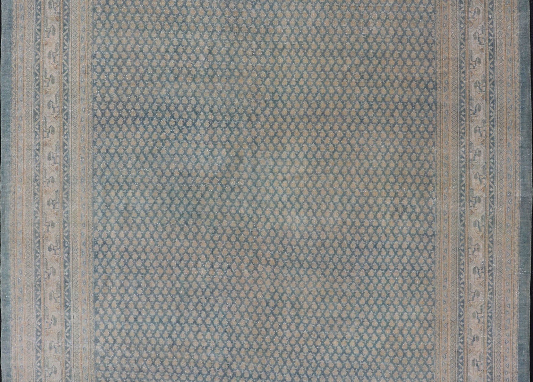 Hand - Knotted Antique Persian Tabriz Rug in Wool with Minimalist Design This Tabriz rug features a relatively intricate and detailed border area and an entirely sparse and small repeating tribal motif in the center field. The tones of this charm... - Keivan Woven ArtsEMB - 9583 - P13517 - 15164Rug
