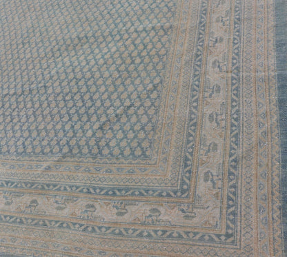 Hand - Knotted Antique Persian Tabriz Rug in Wool with Minimalist Design This Tabriz rug features a relatively intricate and detailed border area and an entirely sparse and small repeating tribal motif in the center field. The tones of this charm... - Keivan Woven ArtsEMB - 9583 - P13517 - 15164Rug