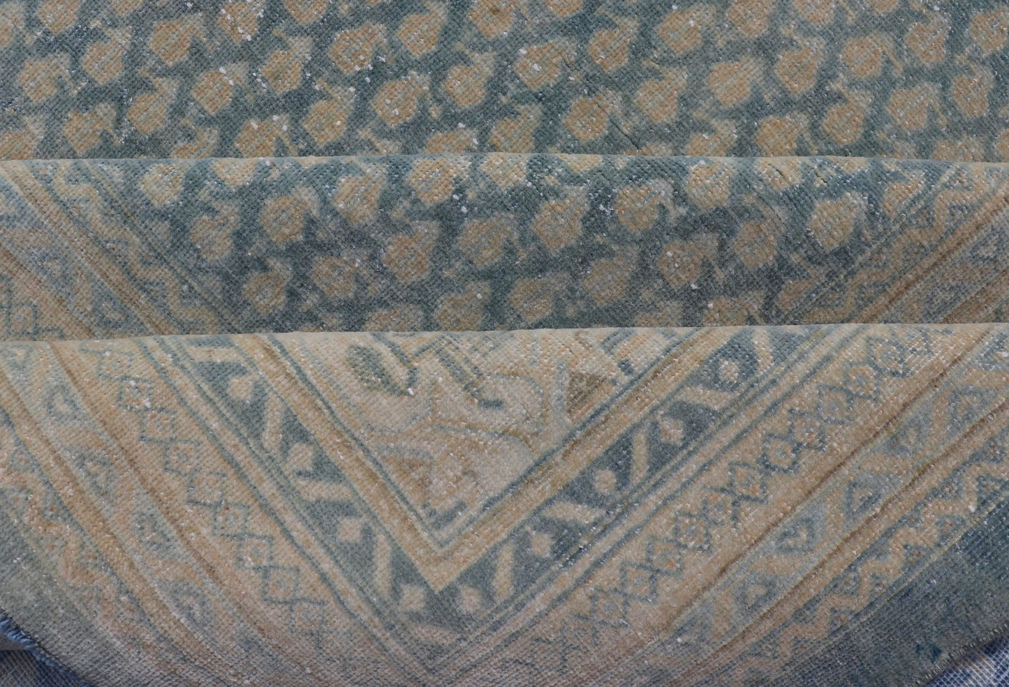 Hand - Knotted Antique Persian Tabriz Rug in Wool with Minimalist Design This Tabriz rug features a relatively intricate and detailed border area and an entirely sparse and small repeating tribal motif in the center field. The tones of this charm... - Keivan Woven ArtsEMB - 9583 - P13517 - 15164Rug