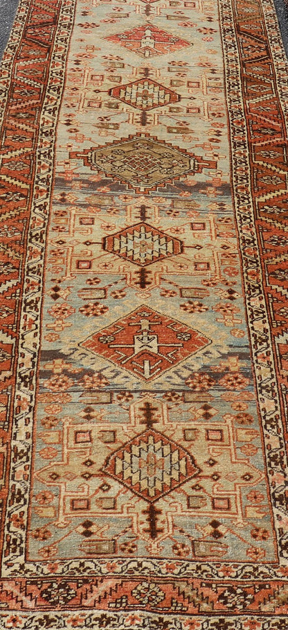 Multi Colored Long Antique Persian Heriz Runner with Geometric Medallions. Keivan Woven Arts / rug EMB - 9588 - P13575, country of origin / type: Iran / Heriz, circa 1910 This magnificent Heriz Serapi runner woven in the early 20th century bears an ... - Keivan Woven ArtsEMB - 9588 - P13575 - 15190Rug