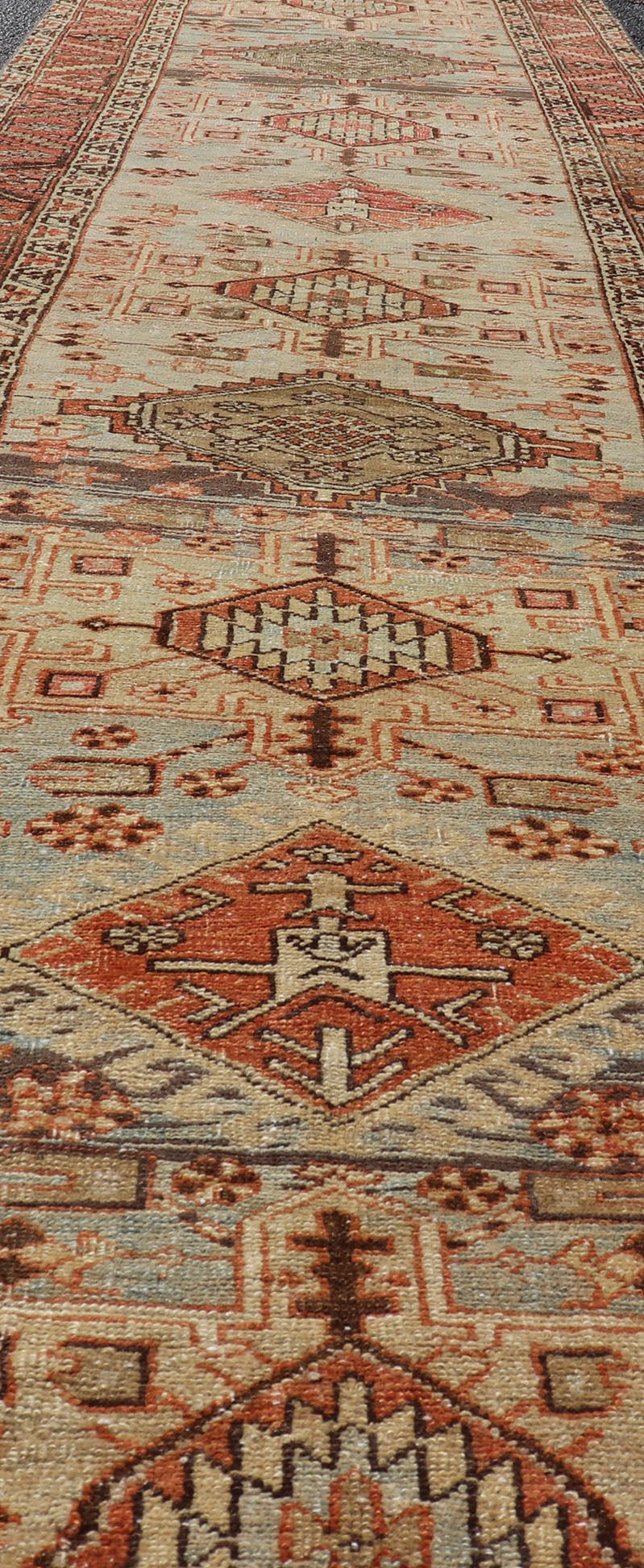 Multi Colored Long Antique Persian Heriz Runner with Geometric Medallions. Keivan Woven Arts / rug EMB - 9588 - P13575, country of origin / type: Iran / Heriz, circa 1910 This magnificent Heriz Serapi runner woven in the early 20th century bears an ... - Keivan Woven ArtsEMB - 9588 - P13575 - 15190Rug