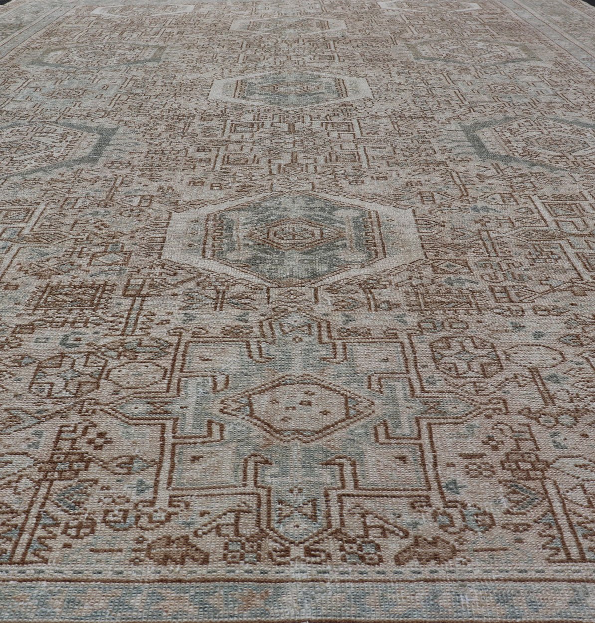 Midcentury Hand Knotted Persian Heriz carpet with layered Medallion and Motifs, rug EMB - 9590 - P13582, country of origin / type: Iran / Heriz, circa mid - 20th century Measures: 9'4 x 12'10 Vintage Persian Heriz Rug with All - Over Med... - Keivan Woven ArtsEMB - 9590 - P13582 - 15202Rug
