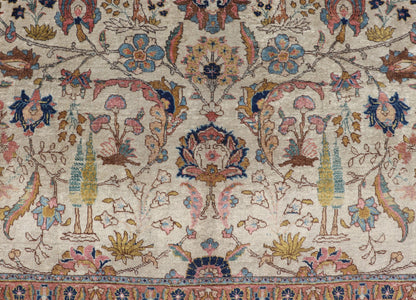 Antique Tabriz with All - Over Floral Sub - Geometric Design & Complementary Border This stunning Antique Tabriz rug (circa 1920s) features a lovely all - over floral design rendered in gold, coral, shades of blue, and pink set upon an Ivory backgroun... - Keivan Woven ArtsEMB - 9593 - P13518 - 15607Rug