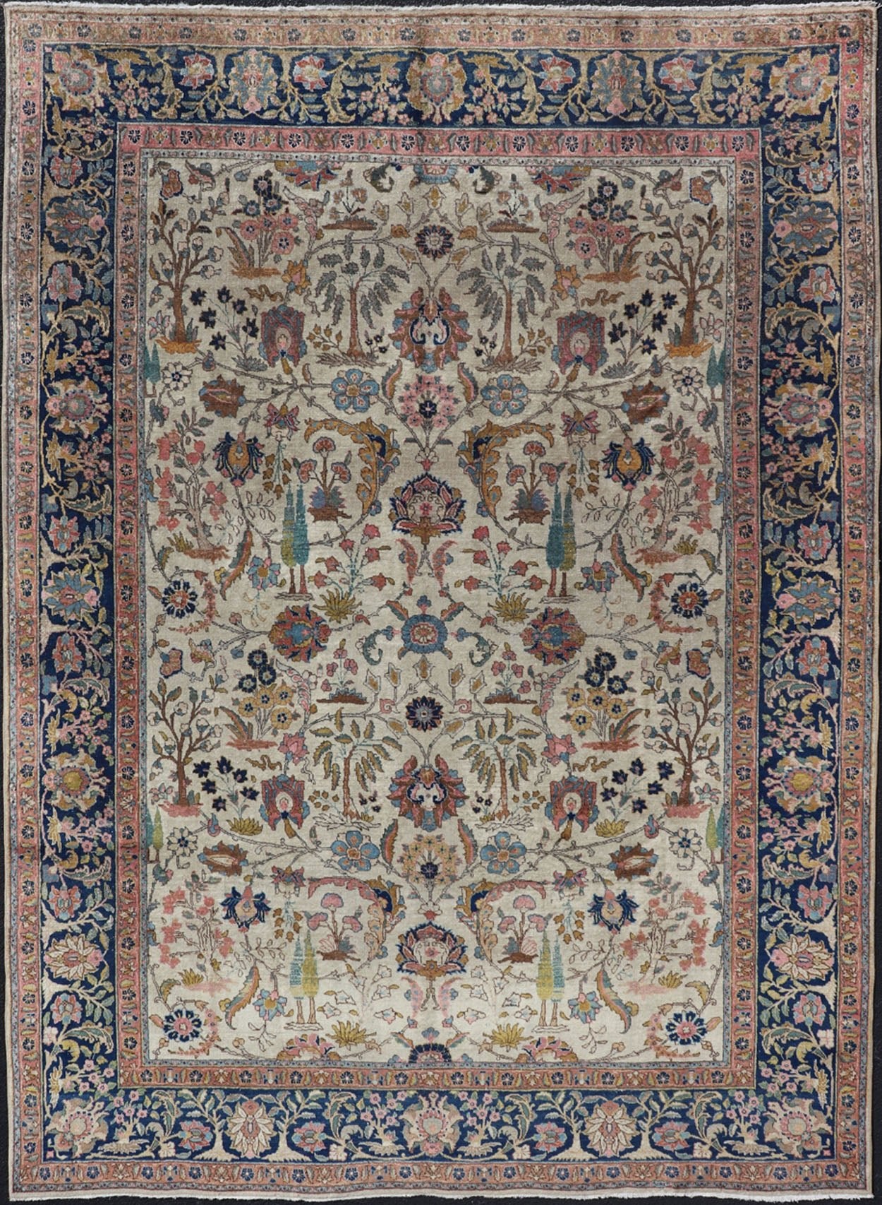 Antique Tabriz with All - Over Floral Sub - Geometric Design & Complementary Border This stunning Antique Tabriz rug (circa 1920s) features a lovely all - over floral design rendered in gold, coral, shades of blue, and pink set upon an Ivory backgroun... - Keivan Woven ArtsEMB - 9593 - P13518 - 15607Rug