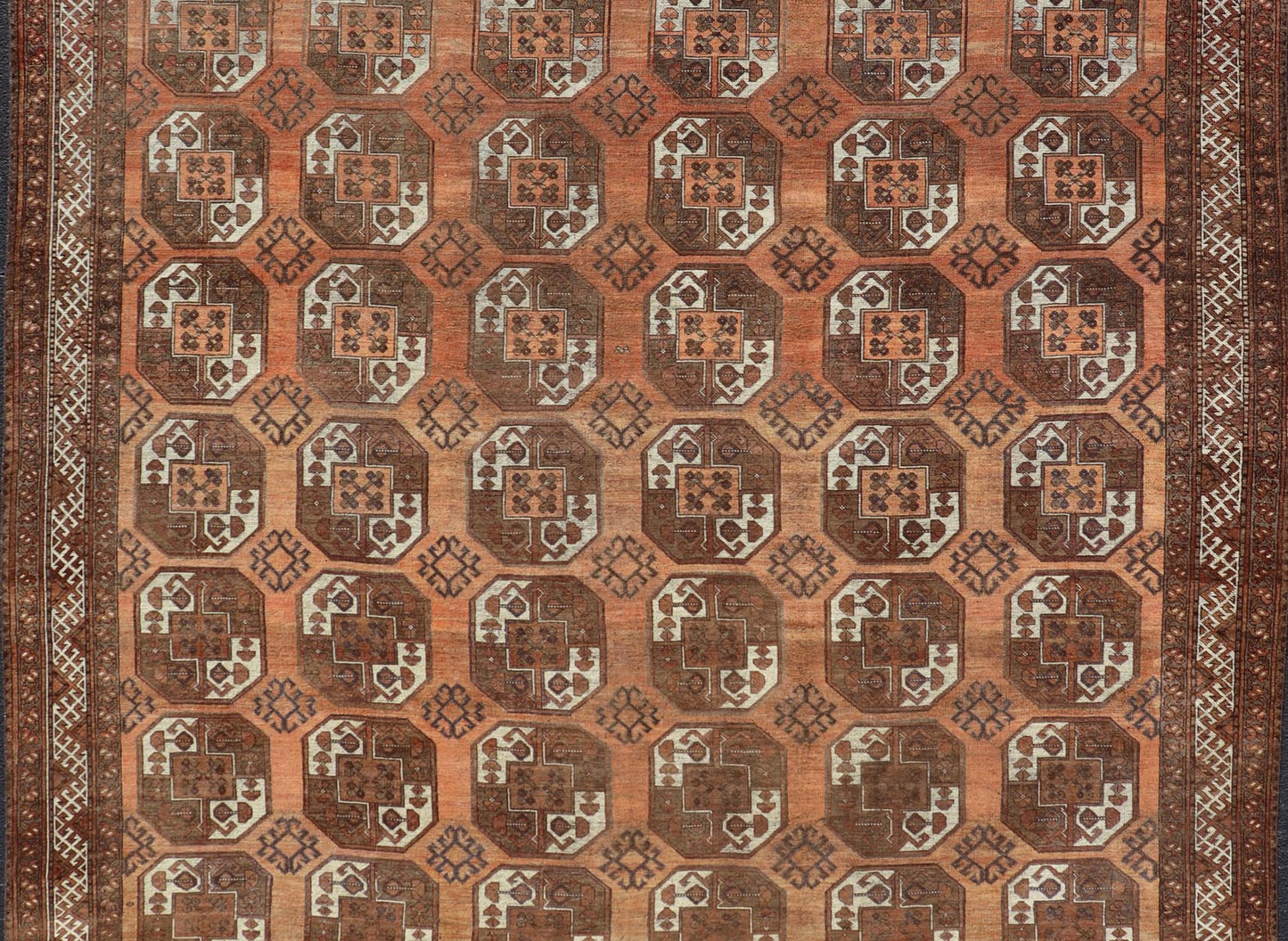 Measures:9'7 x 12'10 Antique Turkomen Ersari Rug in Wool with Repeating Gul Design in Orange, Brown. Keivan Woven Arts; rug EMB - 9594 - 13519, country of origin / type: Turkestan / Ersari, circa 1930s. This Ersari rug has been hand - knotted in th... - Keivan Woven ArtsEMB - 9594 - 13519 - 15613Rug